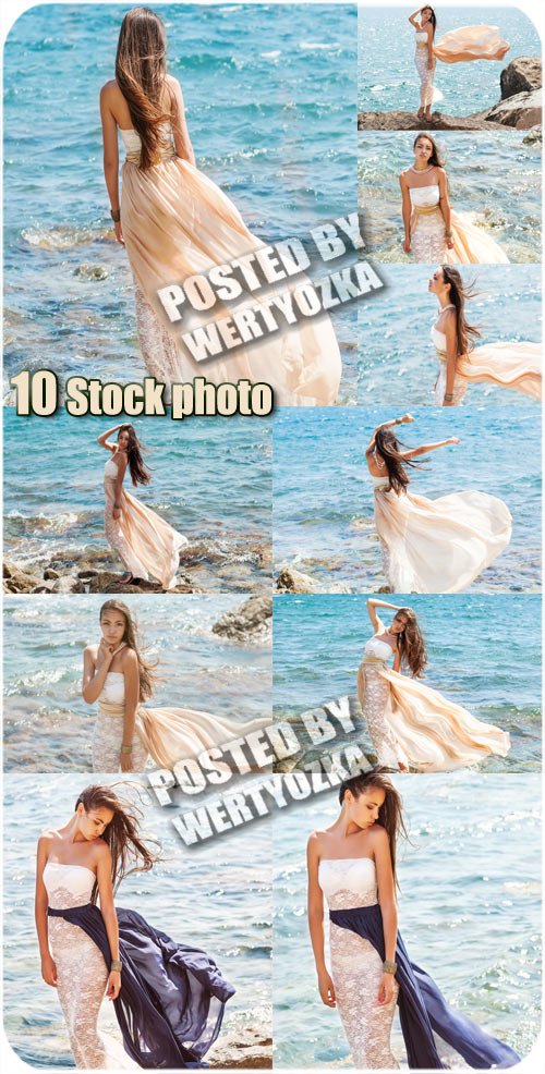 Девушка в длинном платье у моря - сток фото